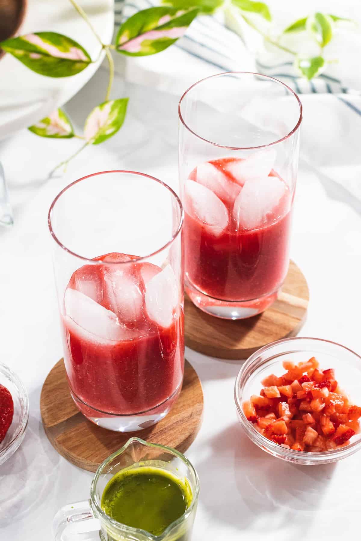 Strawberry puree with ice in two glasses.
