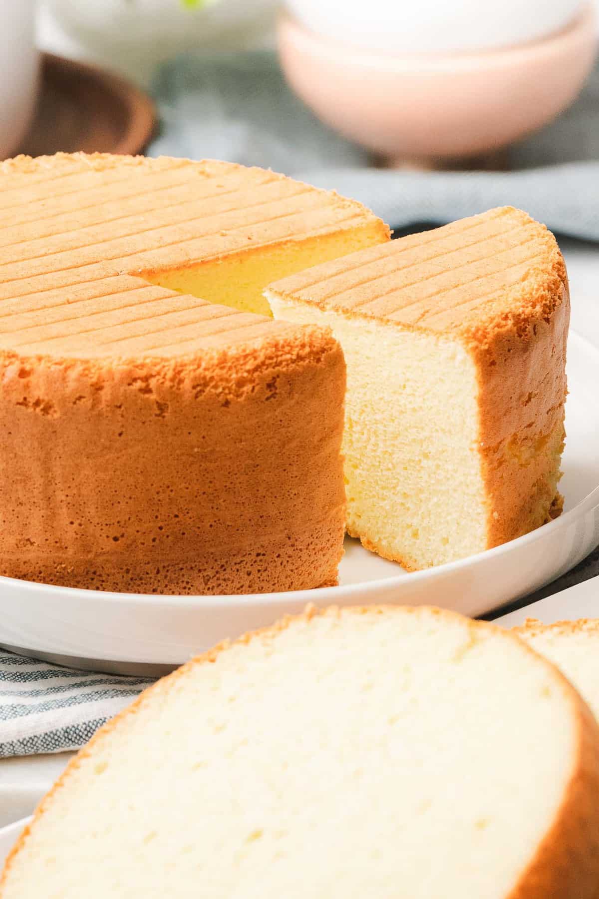 Easy sponge cake with light and fluffy texture cut into a slice.