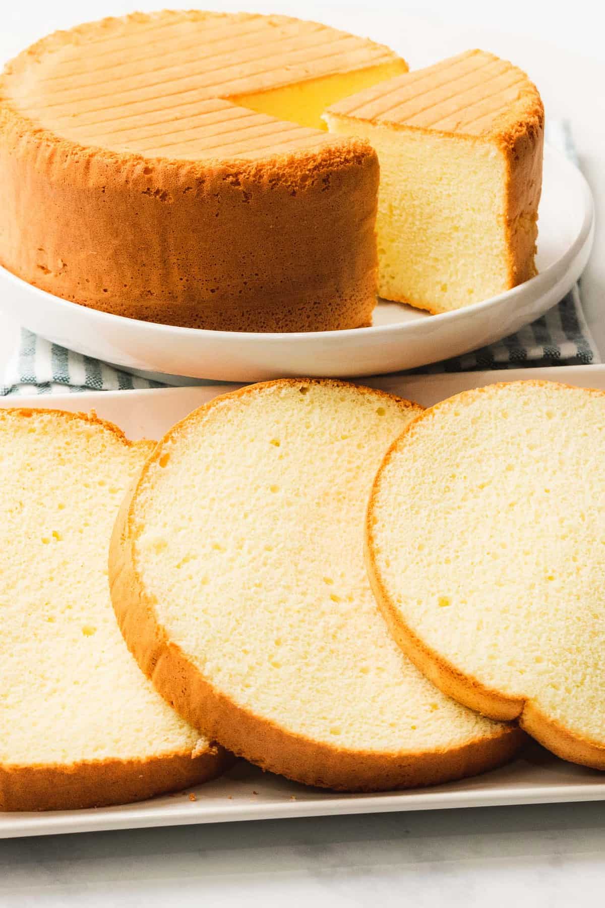 Easy sponge cake with soft, light texture sliced into layers.