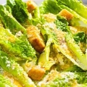 Homemade Caesar salad with text overlay.