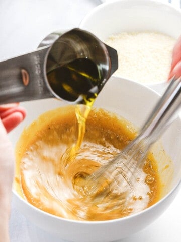 Olive oil slowly whisked with egg yolks, anchovies, and lemon juice.