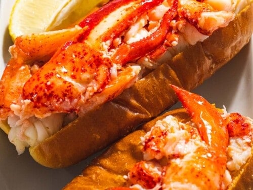 Buttered lobster roll with red claw meat on a toasted bun.