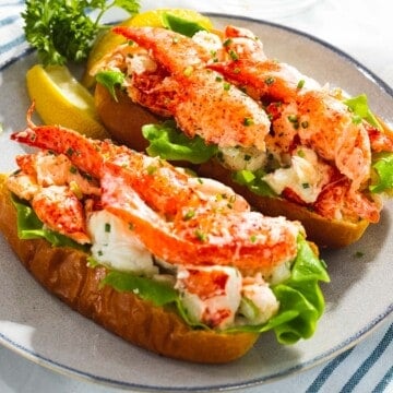 Lobster rolls with juicy, tender lobster meat on a toasted bun.