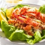 Lobster salad on top of lettuce.