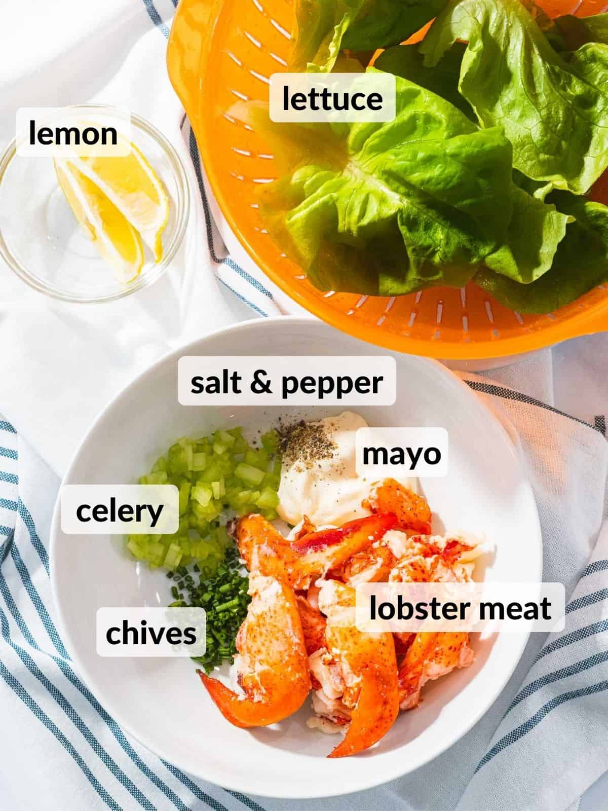 Ingredients for lobster salad including lobster meat, lettuce, and mayo.