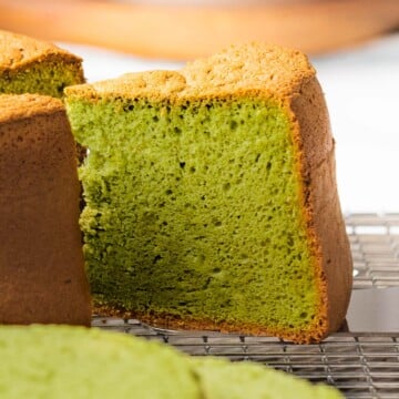 Matcha cake cut open to show soft and fluffy interior.