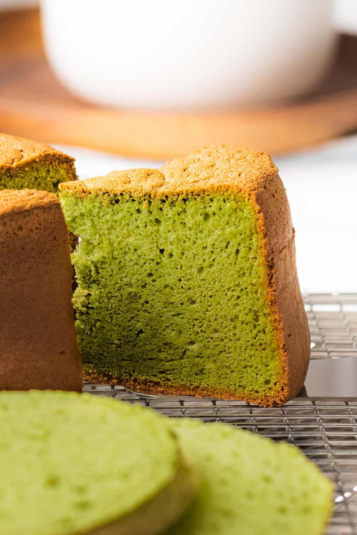 Matcha cake or green tea cake cut into a slice.
