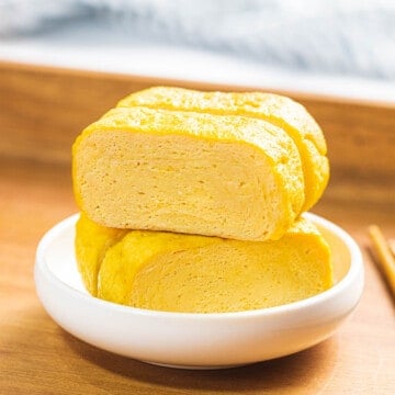 Tamagoyaki or Japanese rolled omelette in a small white bowl.