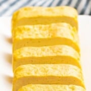 Japanese omelet cut into slices with text overlay.