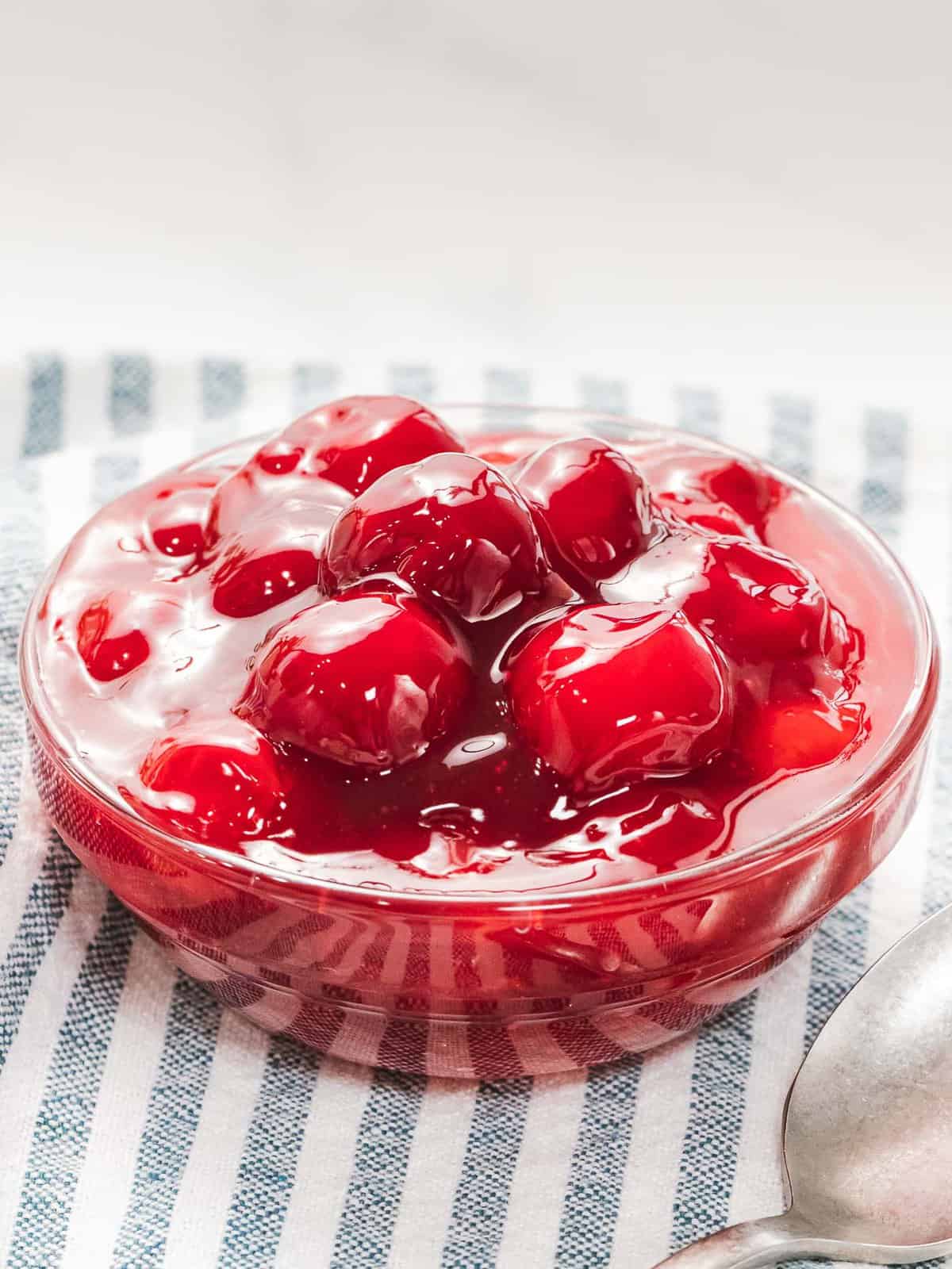 Easy cherry sauce used for topping desserts like cheesecake and cakes.