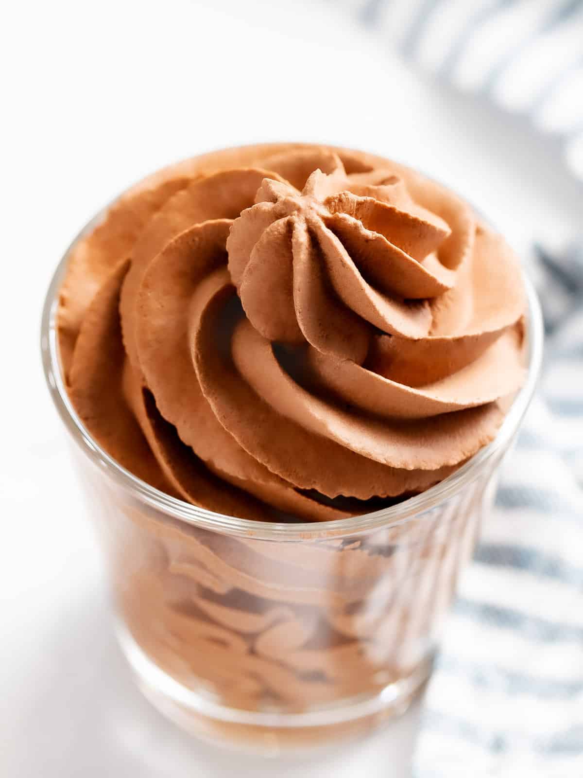 Chocolate whipped cream in a glass cup.
