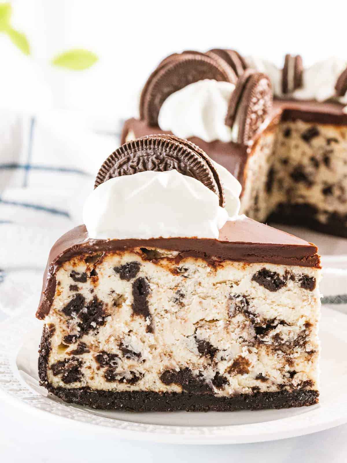 Oreo cheesecake filled with cookies and cream and topped with ganache.