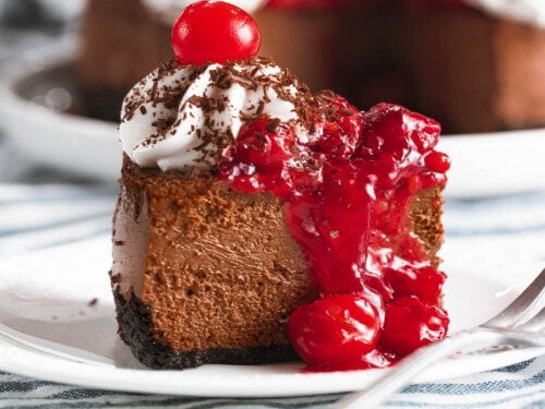 Black forest cheesecake with cherry topping.