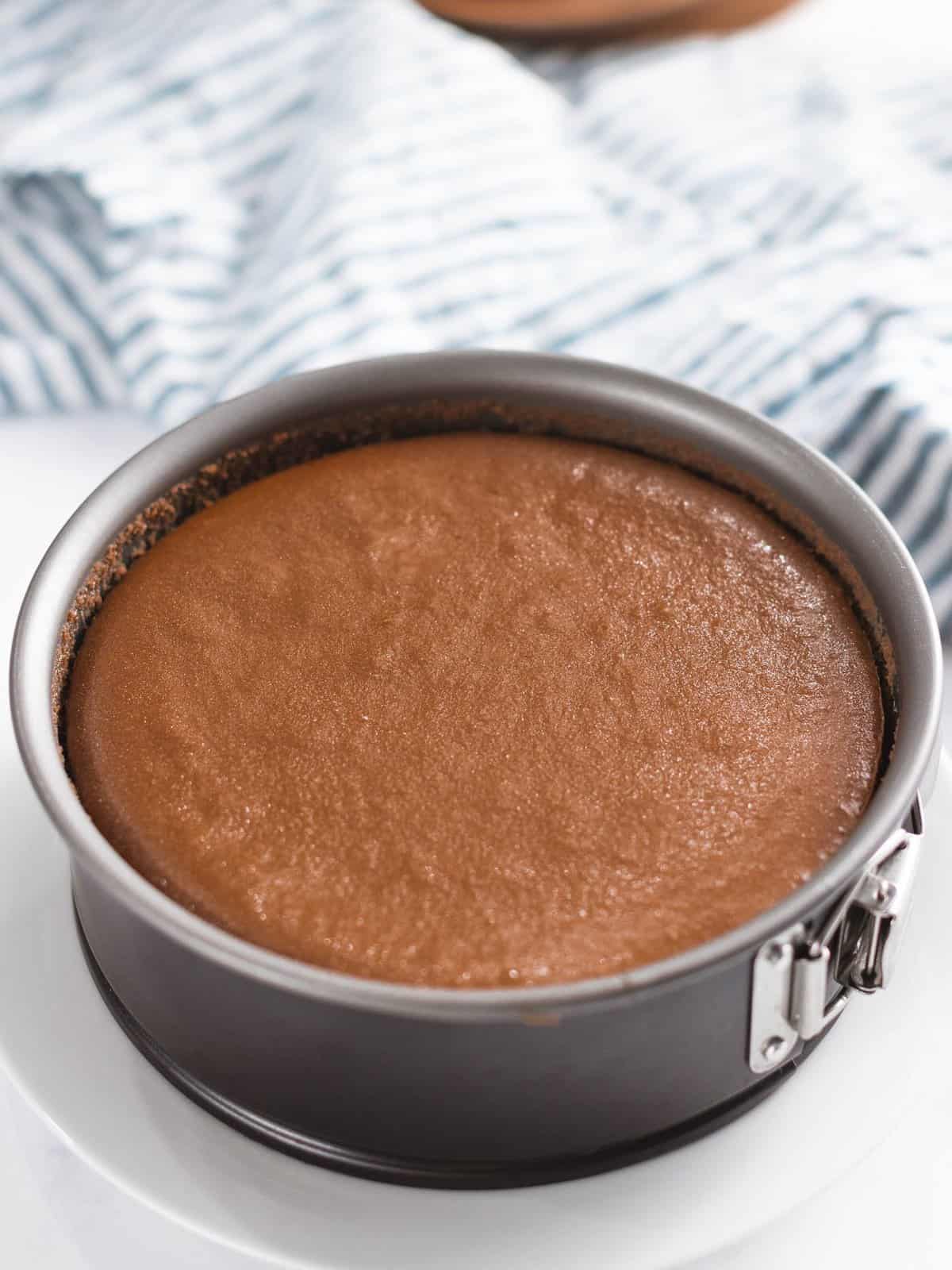 Chocolate cheesecake baked in a springform pan.