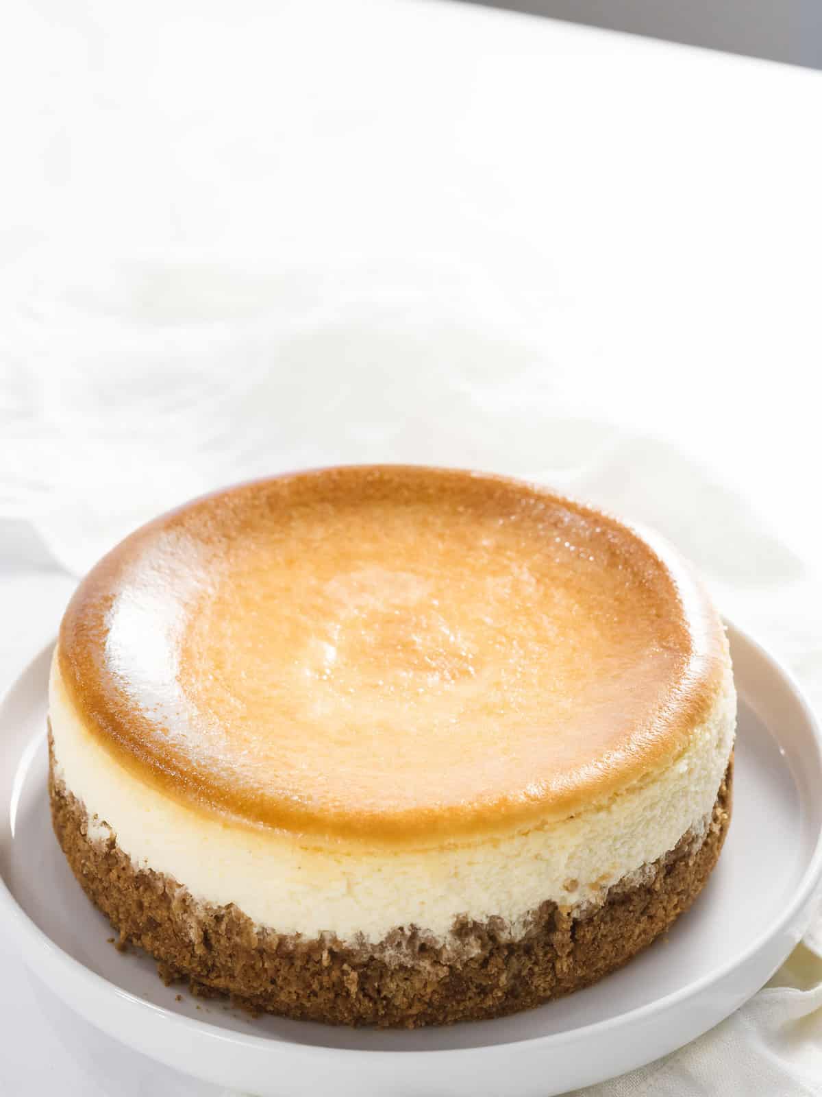 Perfect crack-free New York cheesecake on a plate.