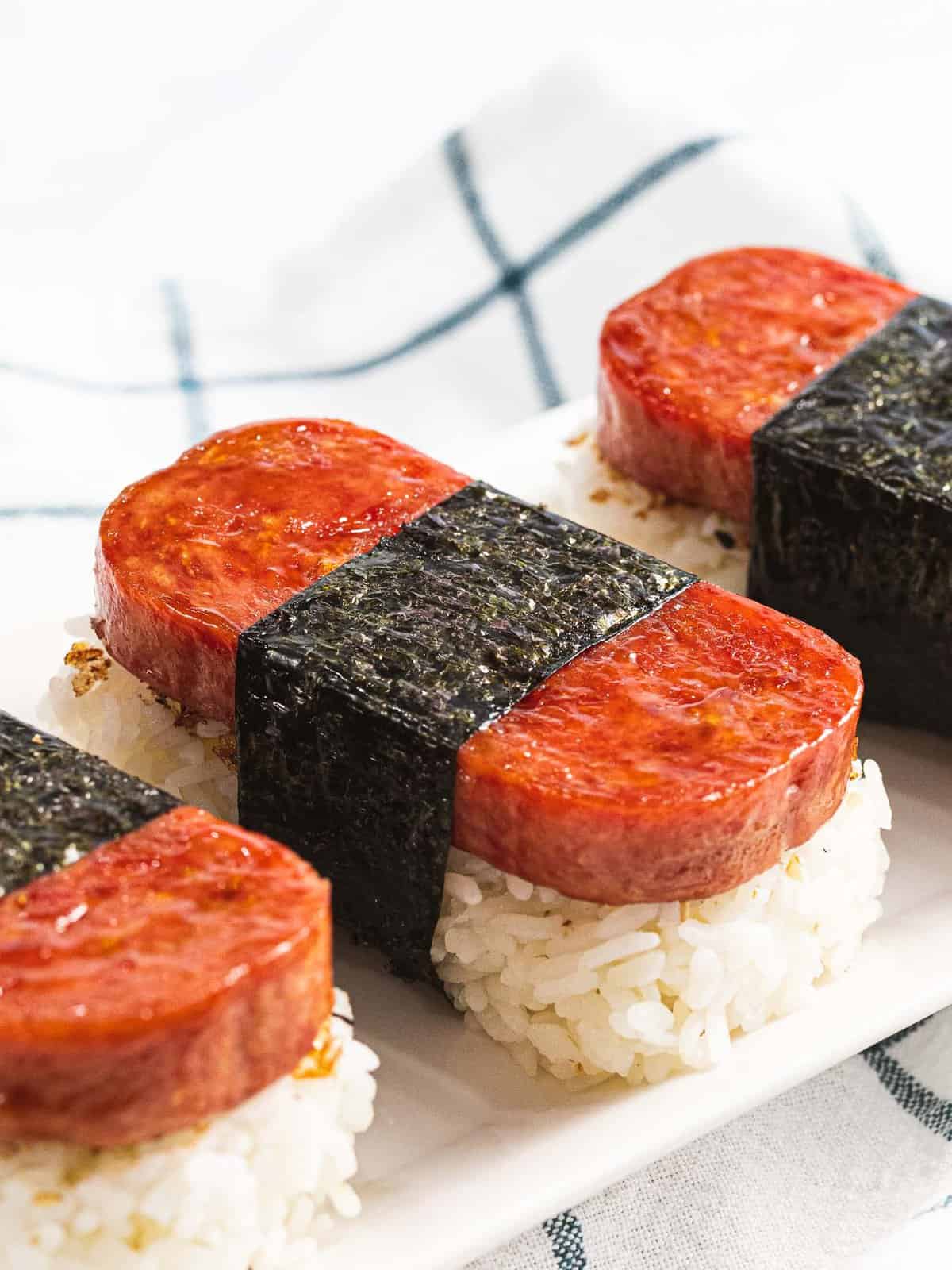 Spam musubi, rice topped with spam and wrapped in nori.