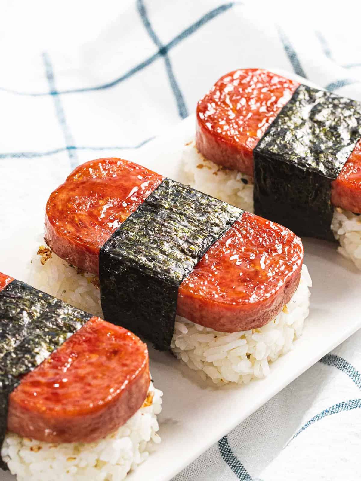 Spam musubi with rice, fried spam, and nori seaweed.