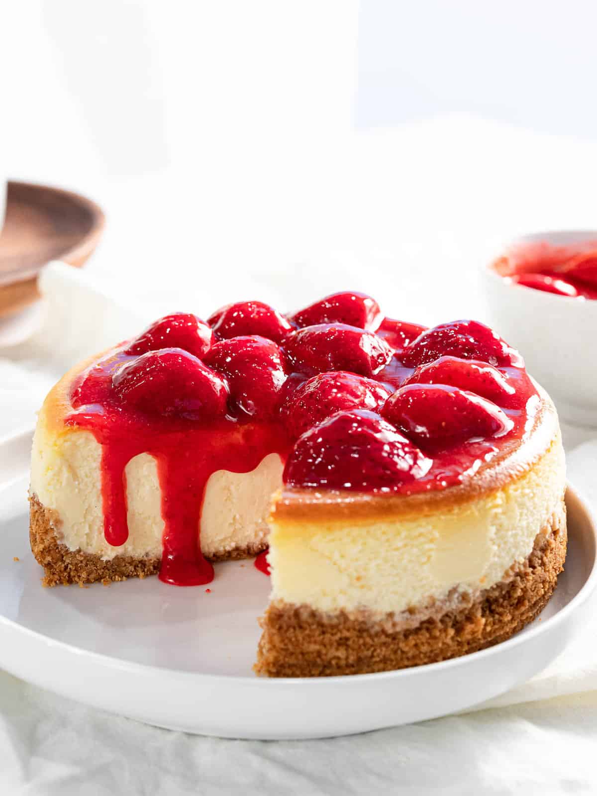 Strawberry cheesecake with strawberry topping and graham cracker crust.
