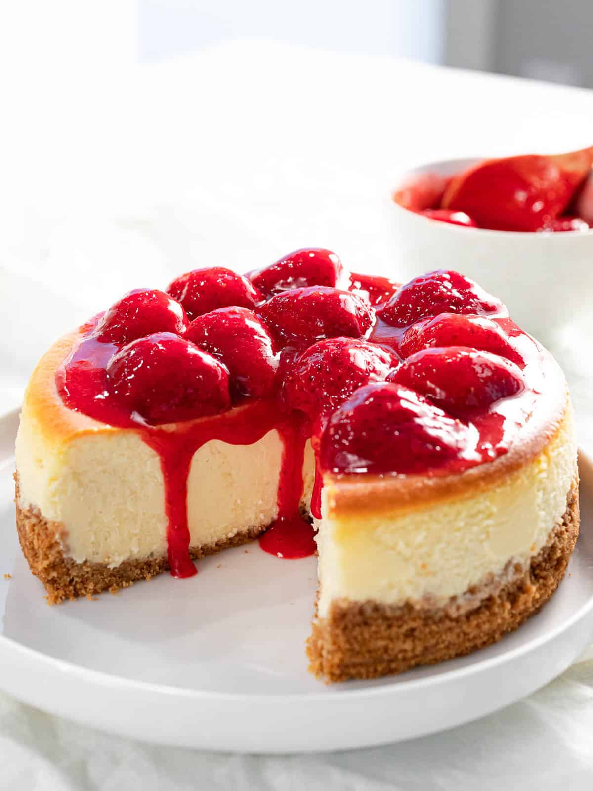 Baked strawberry cheesecake with strawberry topping.