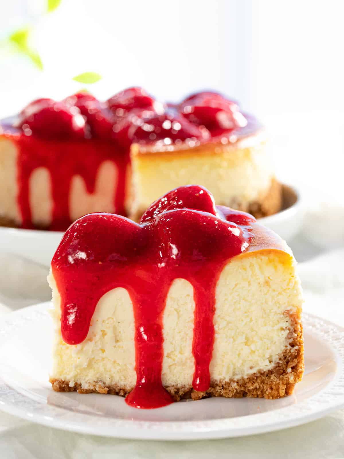 Strawberry sauce on top of cheesecake.