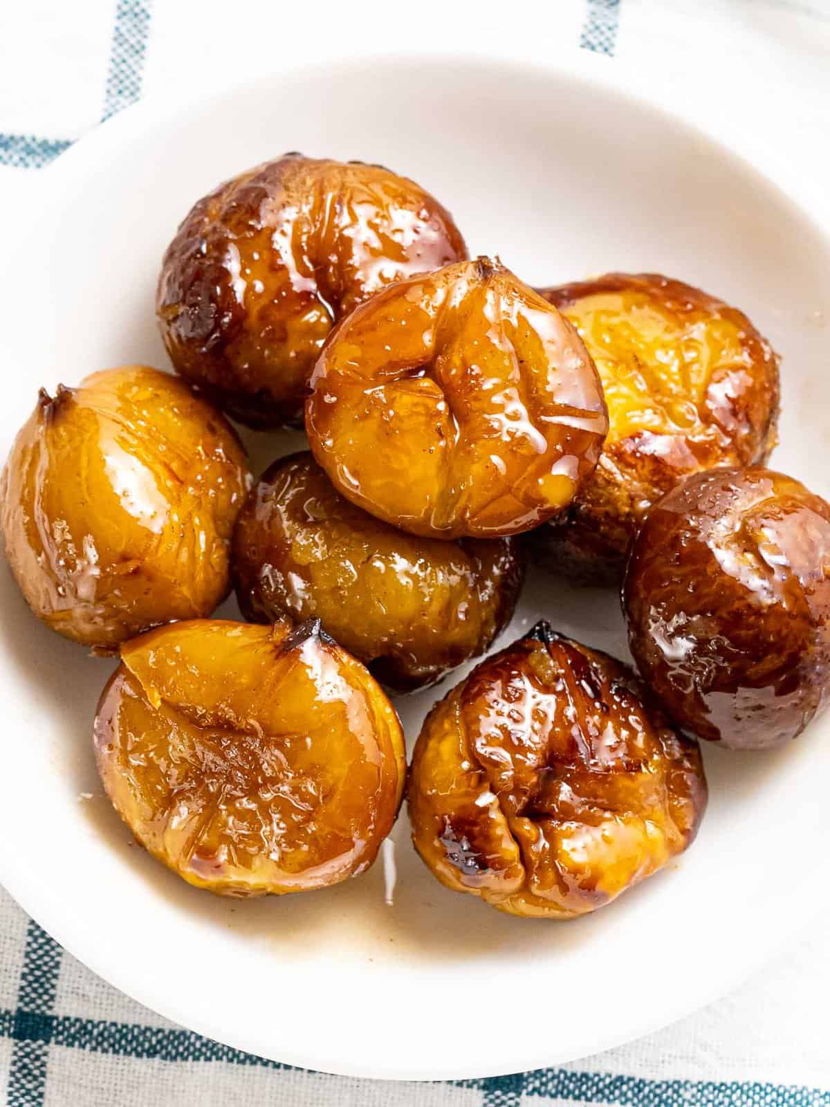 Quick and easy candied chestnuts with a spiced cinnamon sugar glaze.
