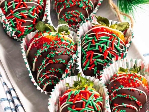 Christmas chocolate-covered strawberries with holiday sprinkles.