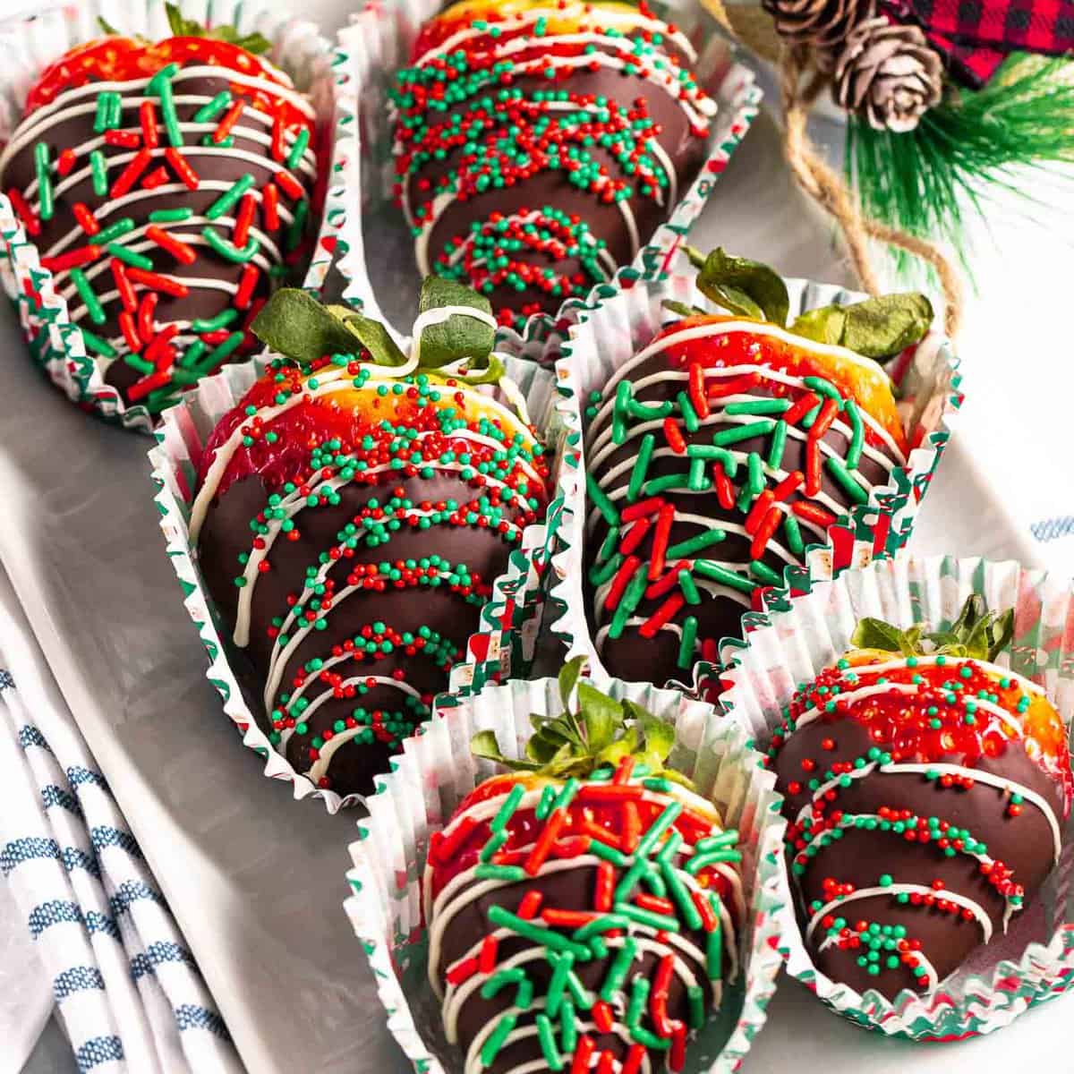 Christmas chocolate-covered strawberries with holiday sprinkles.