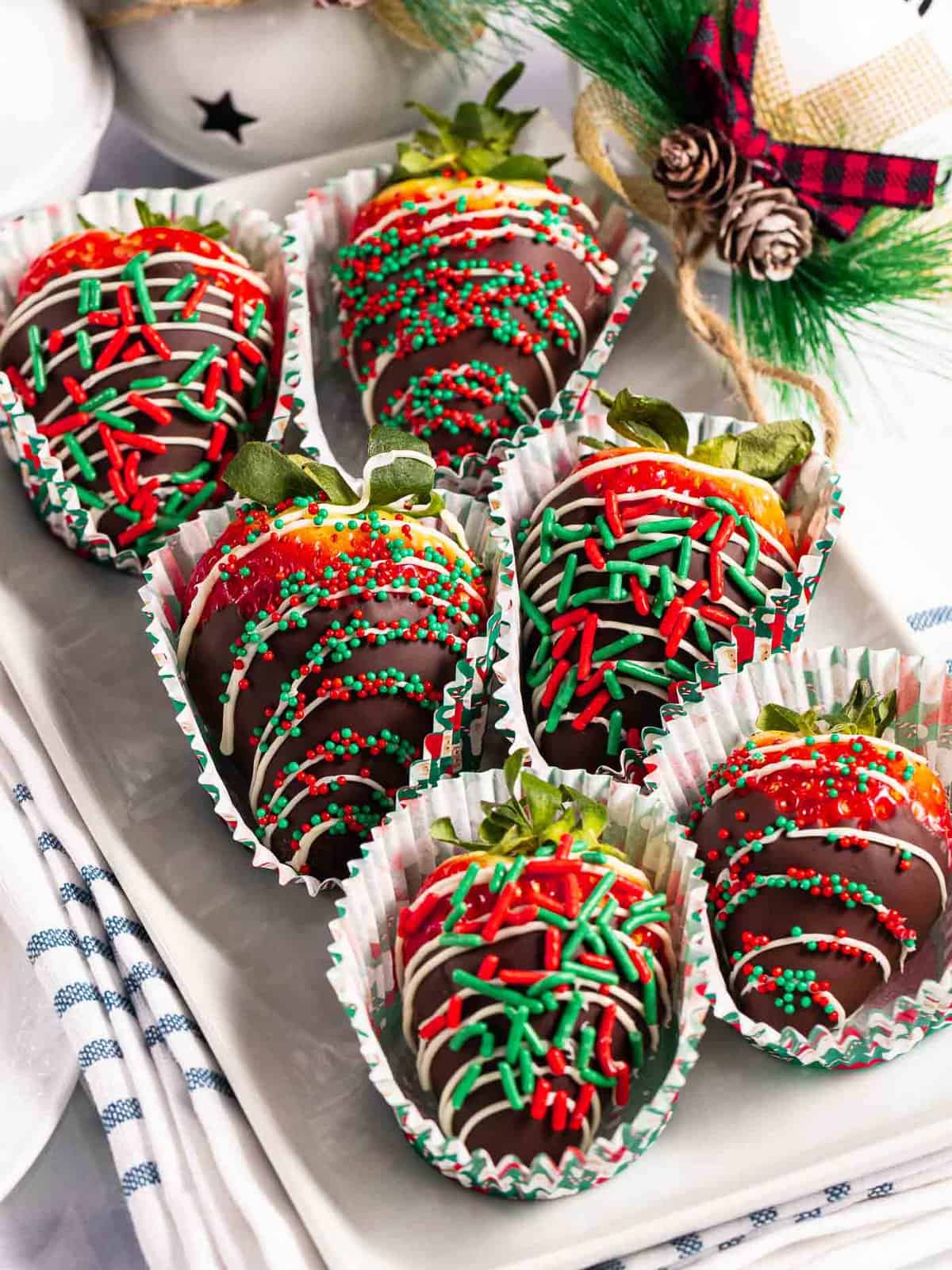 Christmas chocolate-covered strawberries with Christmas sprinkles.