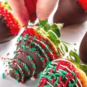 Christmas strawberries covered with chocolate and sprinkles.