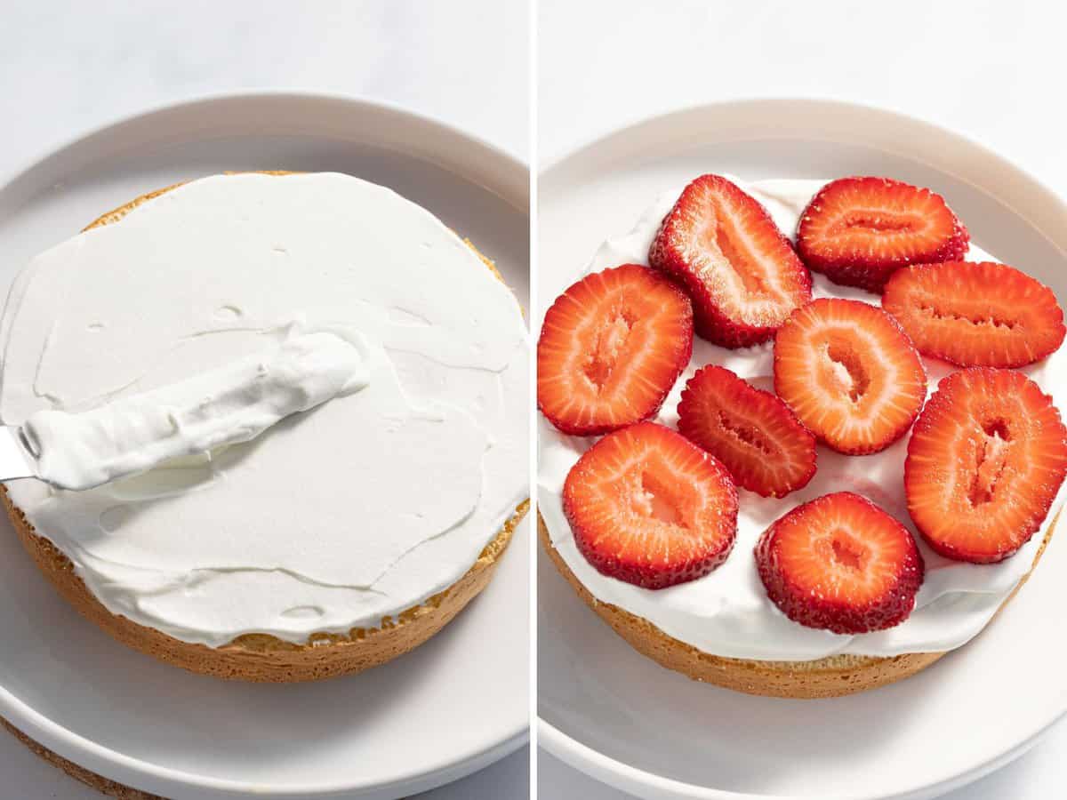 Whipped cream and strawberries added to a cake layer.