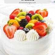 Fresh fruit cake with whipped cream.