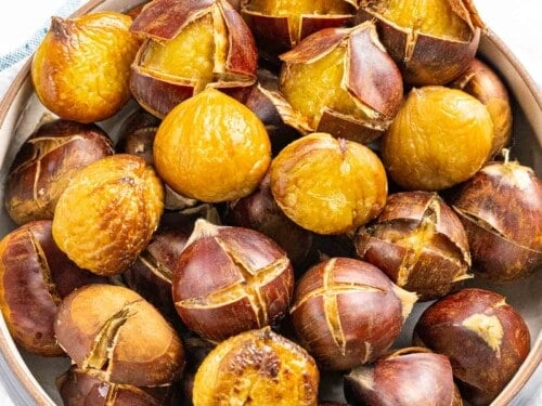 Roasted chestnuts with outer shell peeled back.
