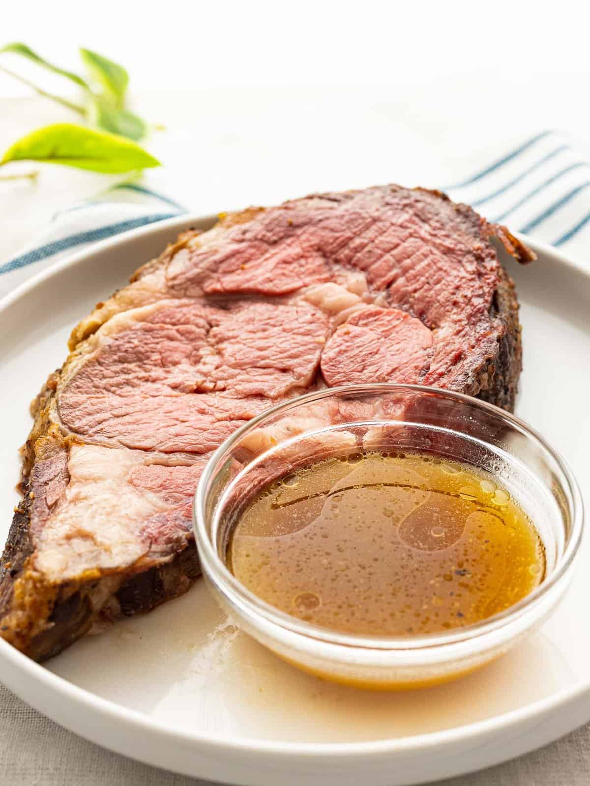 Au jus sauce placed on the side for dipping prime rib.