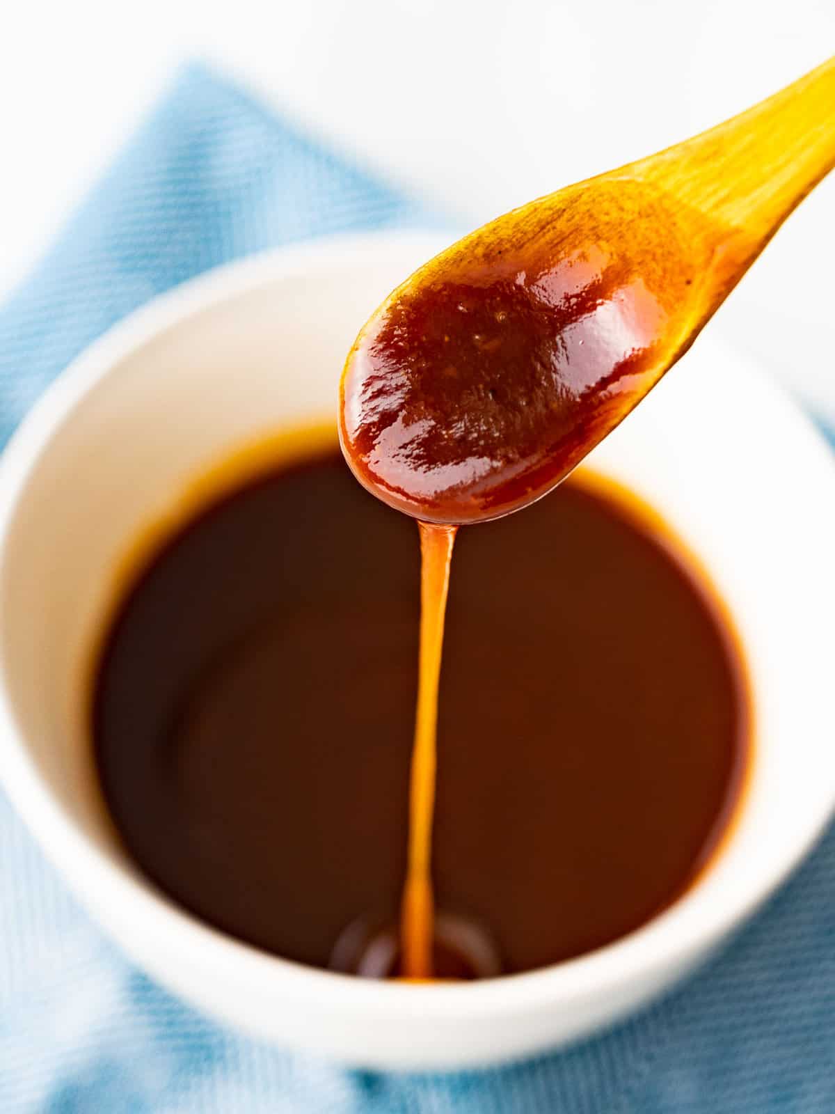 Katsu sauce inspired by bull-dog sauce flowing off a spoon.