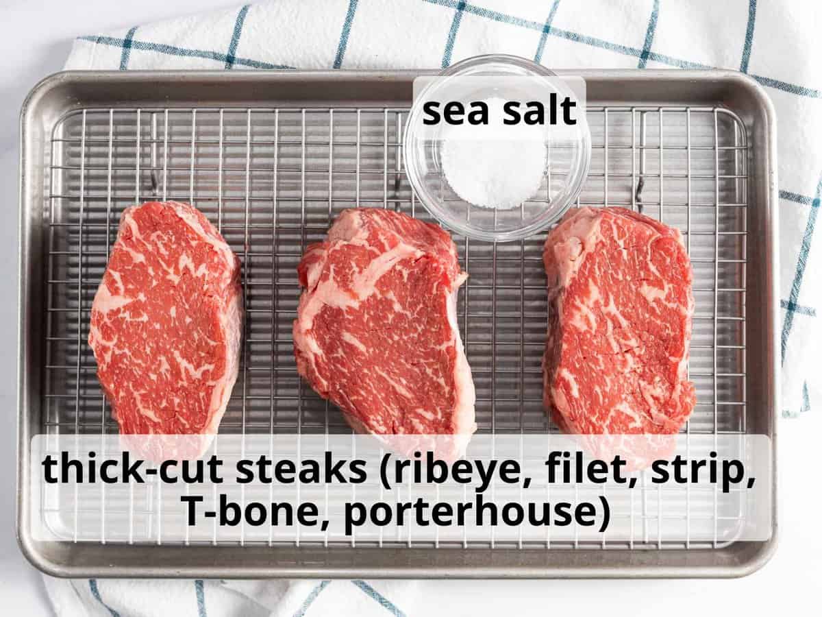 Ingredients for reverse sear steak including thick-cut steaks such as ribeye, filet, or strip.