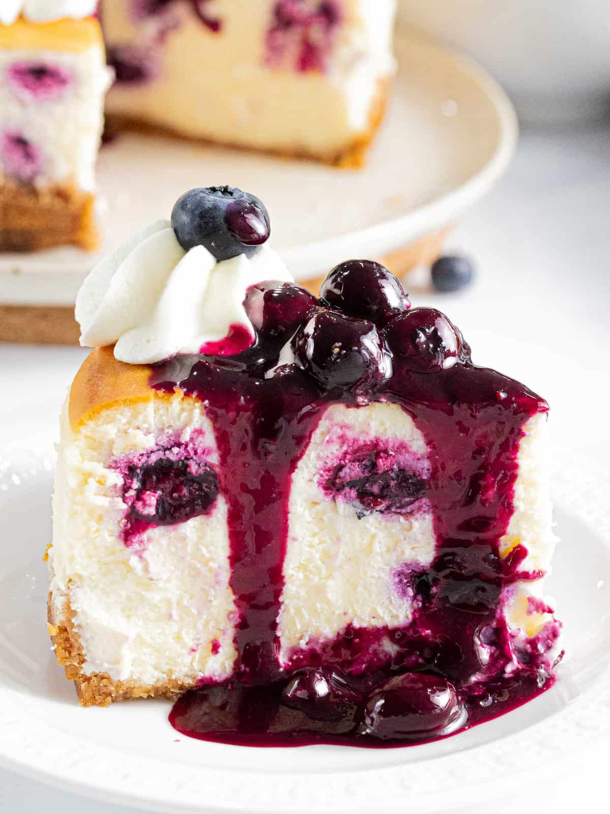 Blueberry cheesecake topped with homemade blueberry sauce.