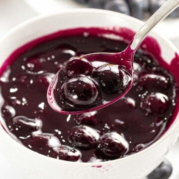 Blueberry compote on a spoon.
