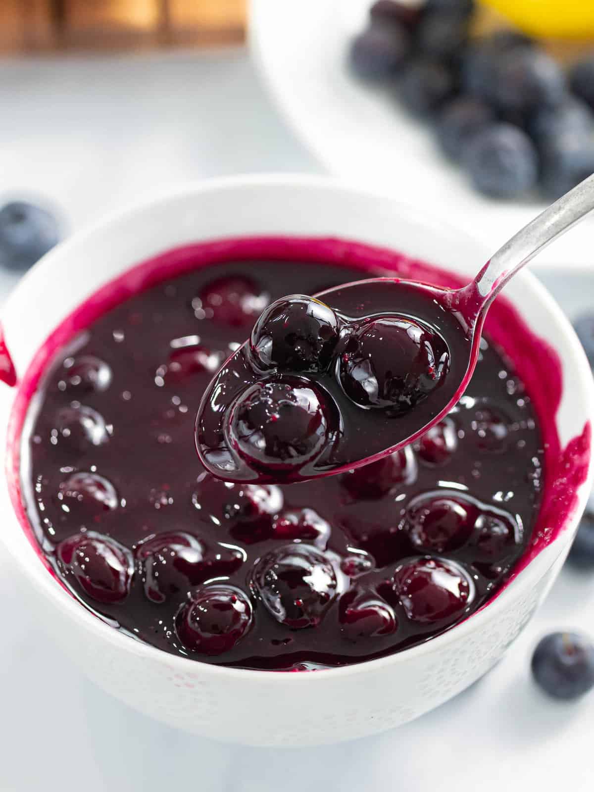 Blueberry compote in a white bowl.