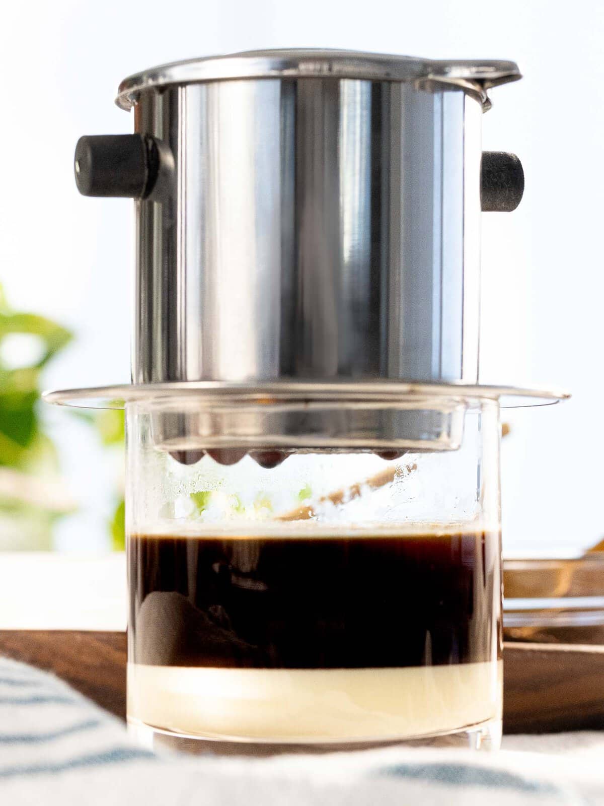 Vietnamese coffee is brewed with a phin filter with sweetened condensed milk.